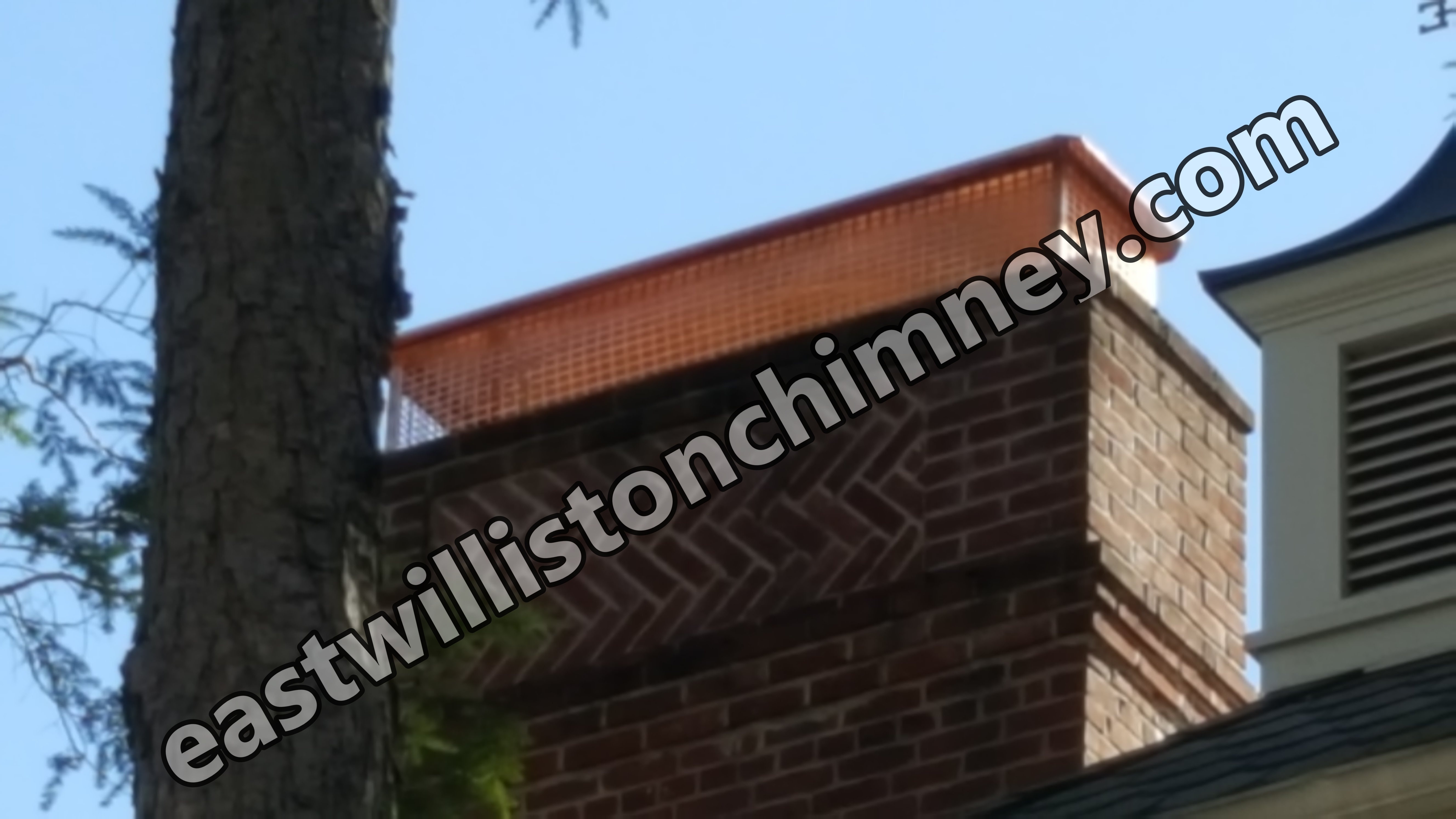 New stainless steel chimney cap installed in East Williston, NY