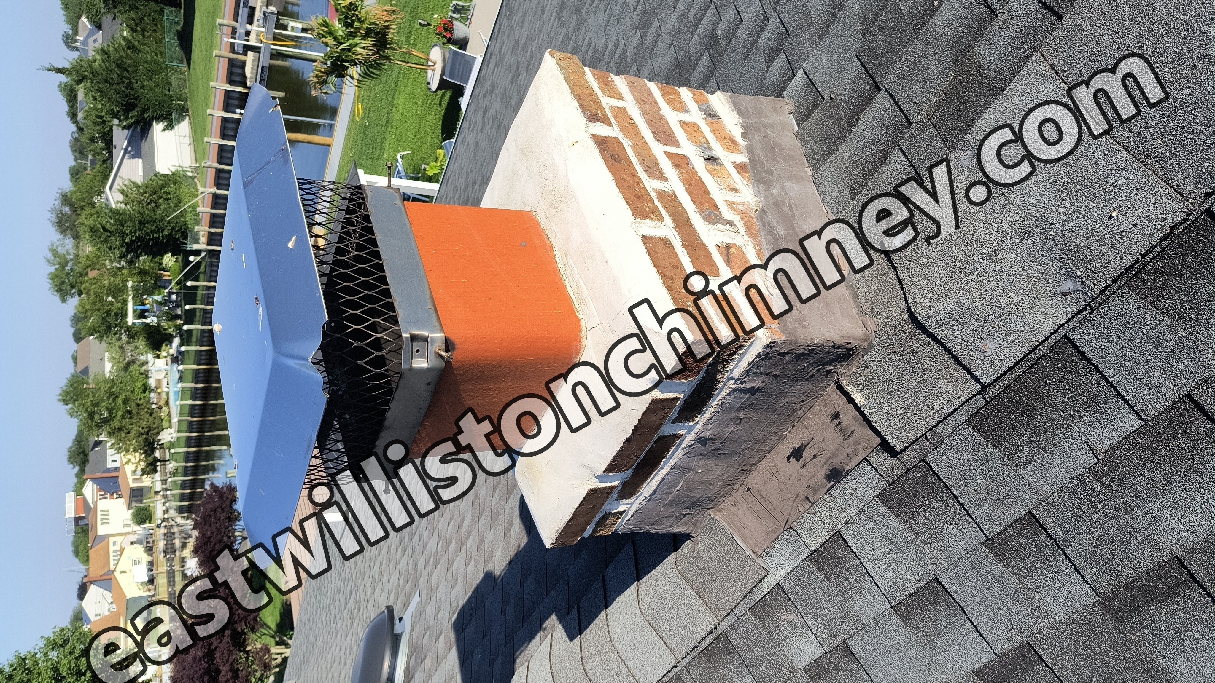 Full chimney masonry rebuild and restoration in East Williston, NY