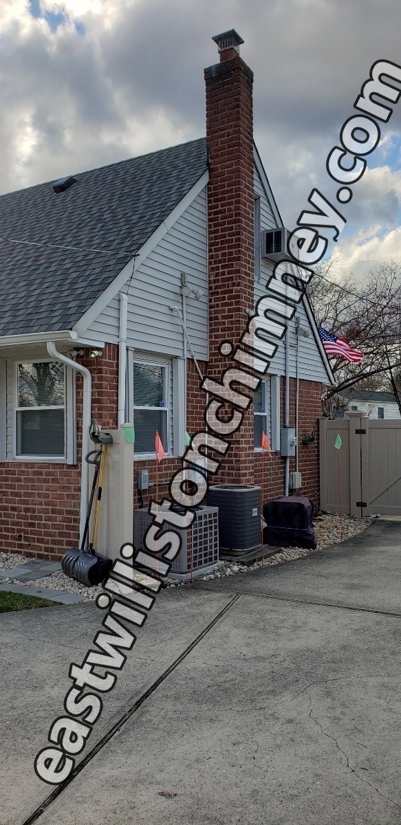 Professional chimney repointing restoring brick joints in East Williston, NY