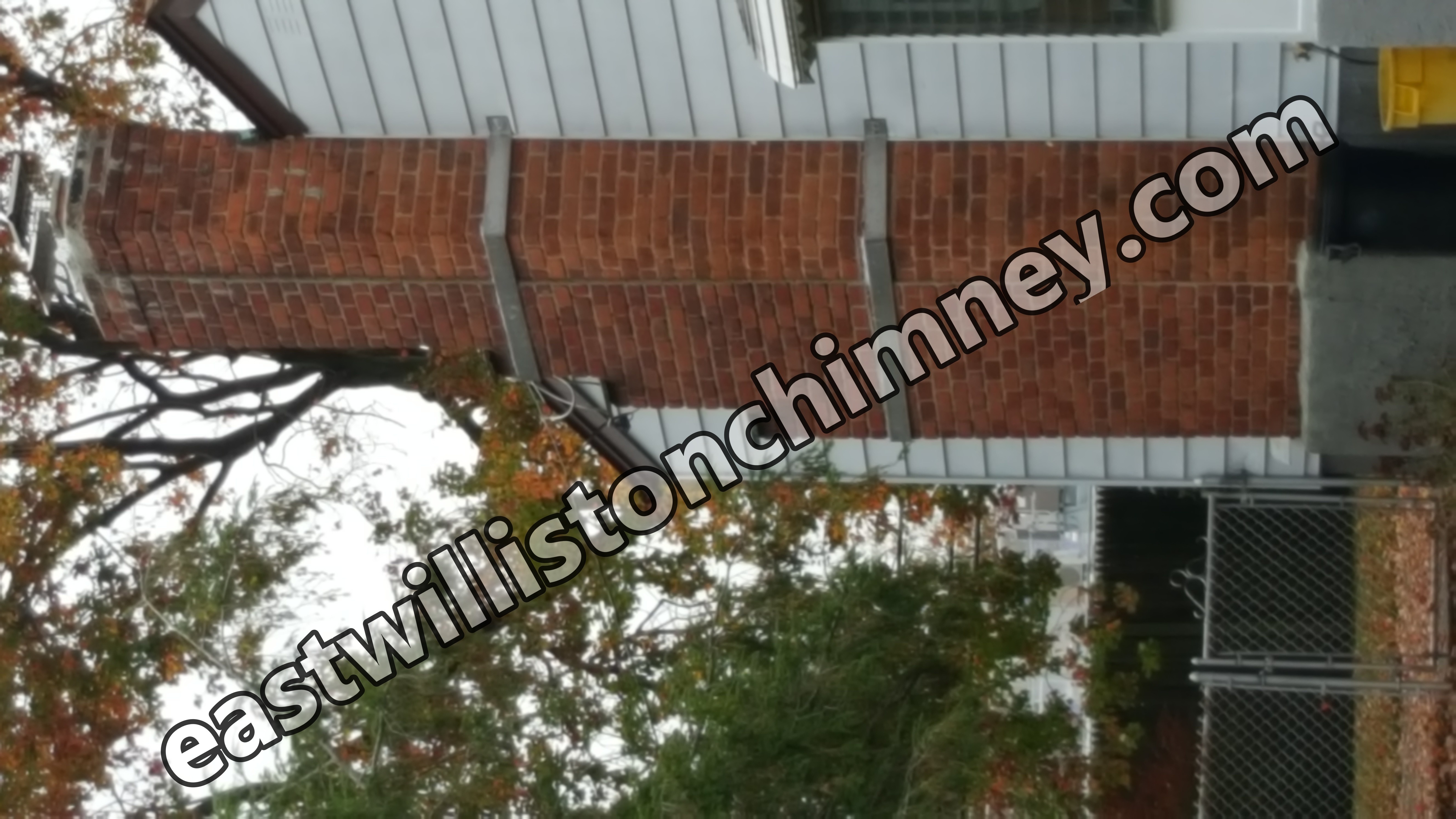 Heavy oil soot removal from chimney flue in East Williston, New York